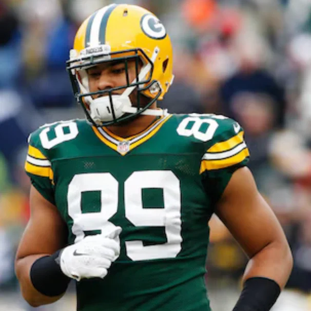 NFL Tight End Richard Rodgers running on the field in his green and yellow Green Bay Packers uniform, number 89