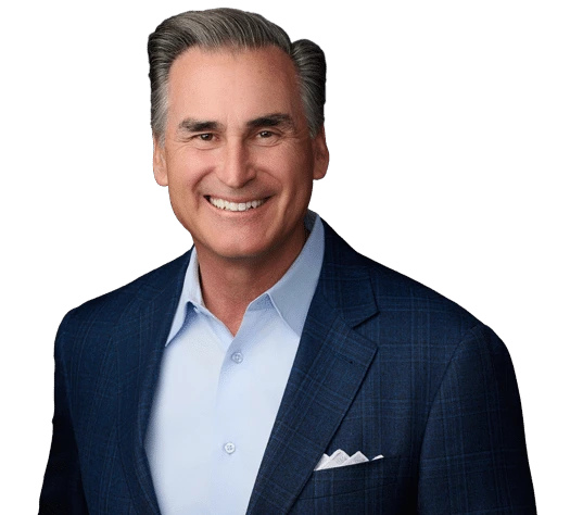 Professional headshot of Tim Ristoff, Chairman of the Play It Forward Initiative, smiling in a blue suit jacket and light blue shirt.